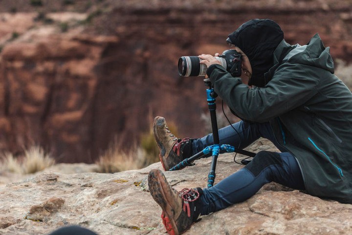 a man sitting on a rock