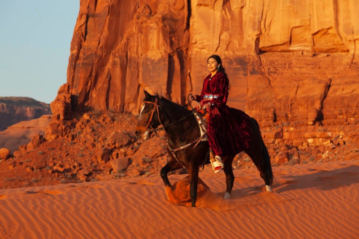a man riding a horse in the snow